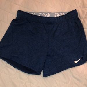 Blue Nike running shorts